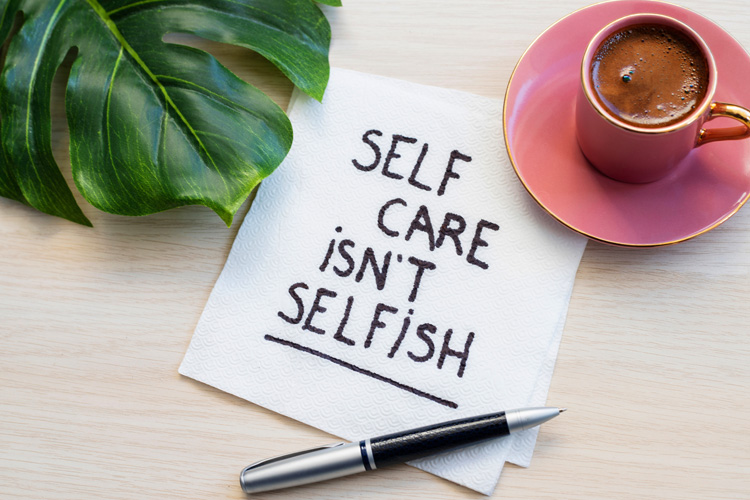 Clermont Park Senior Living Community in Denver, CO - clermont park self care isn t selfish written on napkin with coffee