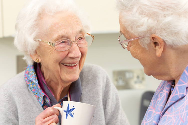 Clermont Park Senior Living Community in Denver, CO - clermont park two senior woman laughing