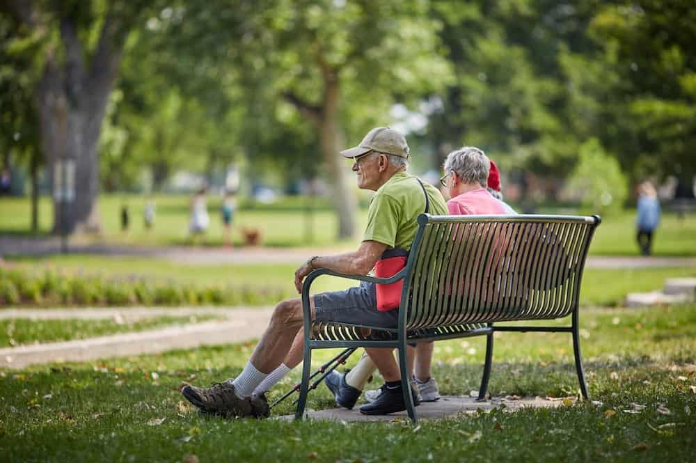 Independent living residents on bench at Clermont Park