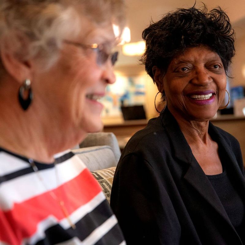 Clermont Park Senior Living Community in Denver, CO - two older women laughing square