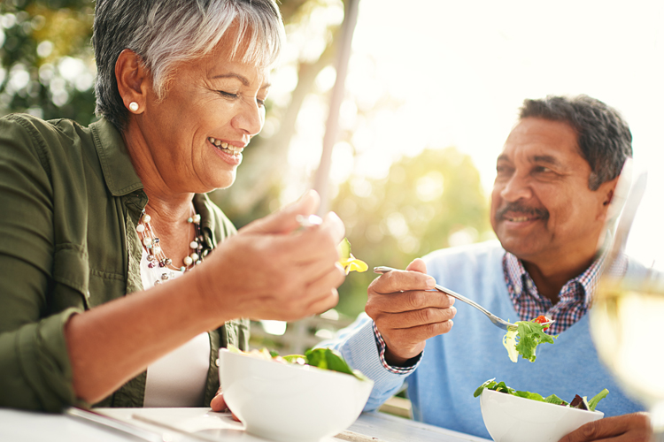 Clermont Park Senior Living Community in Denver, CO - couple eating salad