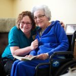 Clermont Park skilled nursing resident and care partner smiling