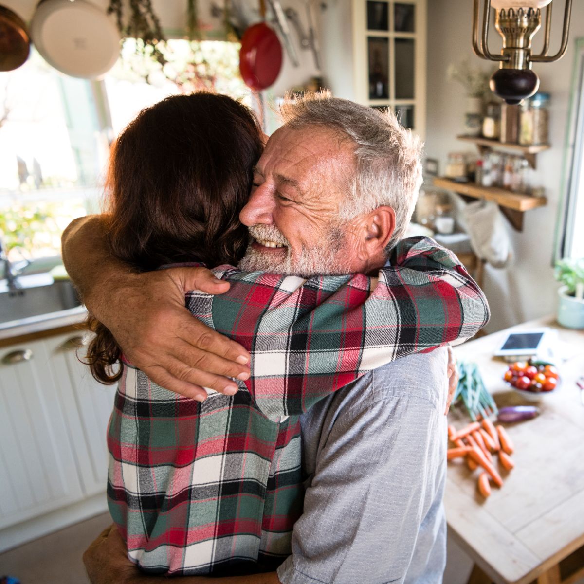 Clermont Park Senior Living Community in Denver, CO - holiday tips for caregivers father and adult daughter hugging