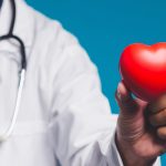 Clermont Park Senior Living Community in Denver, CO - doctor holding plastic heart