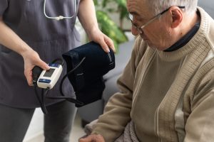 Clermont Park Senior Living Community in Denver, CO - man with blood pressure cuff