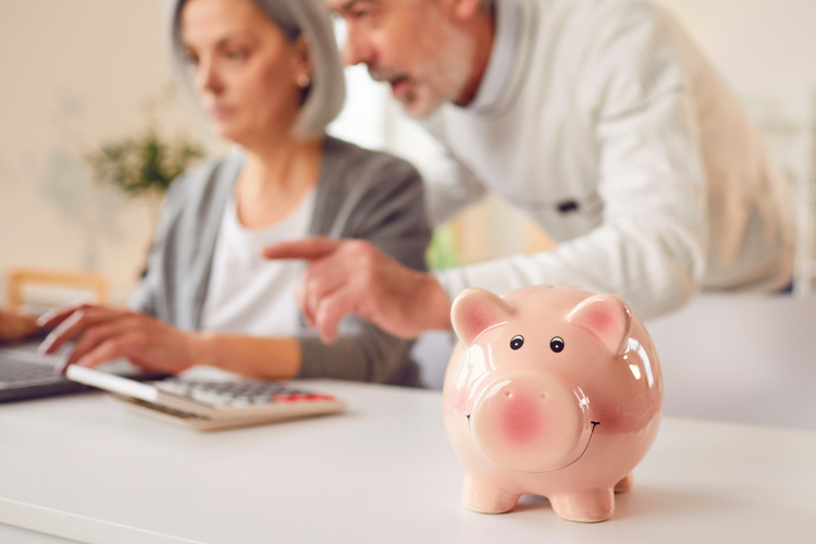 clermont park senior couple meeting with advisor Clermont Park Senior Living Community in Denver, CO - clermont park senior couple working on finances
