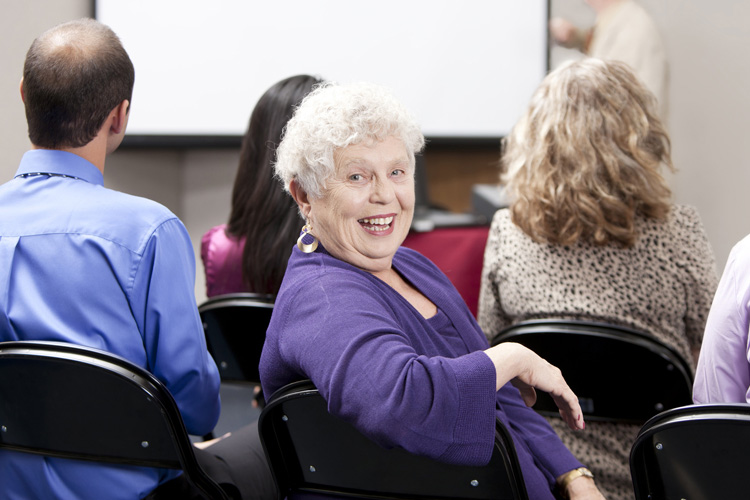 Clermont Park Senior Living Community in Denver, CO - clermont park senior woman in a group meeting with leader