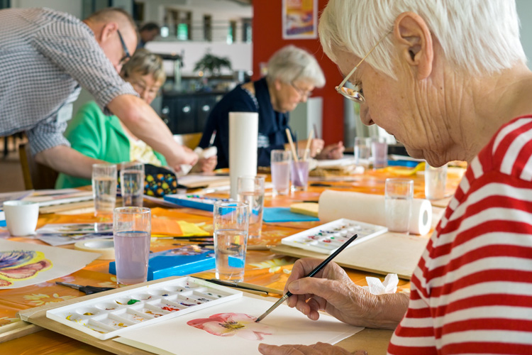 Clermont Park Senior Living Community in Denver, CO - clermont park group of seniors making artwork